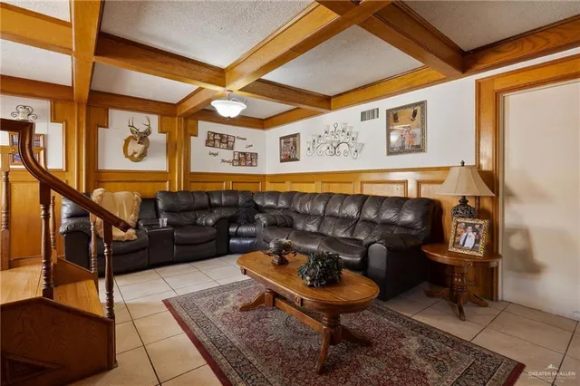 a living room with furniture and a rug