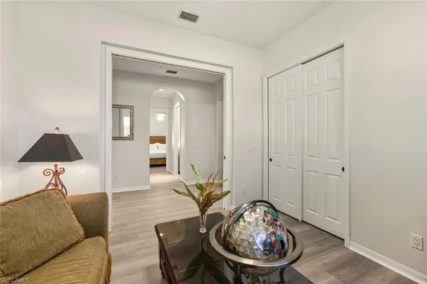a living room with furniture and a window