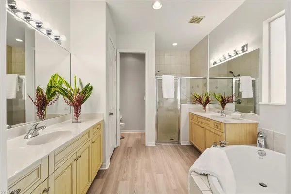 a bathroom with a double vanity sink and a mirror