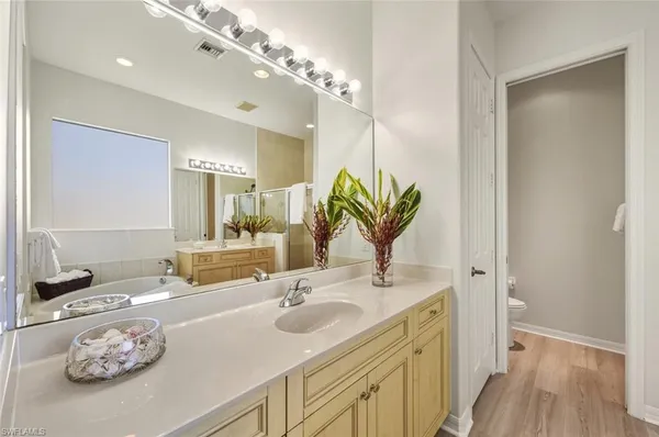 a bathroom with a sink double vanity and a mirror