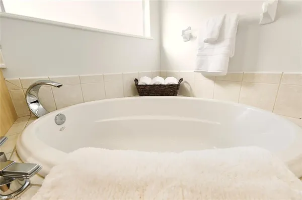 a white bath tub sitting in a bathroom