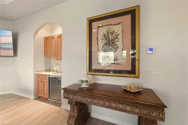 a kitchen with a sink cabinets and a microwave oven