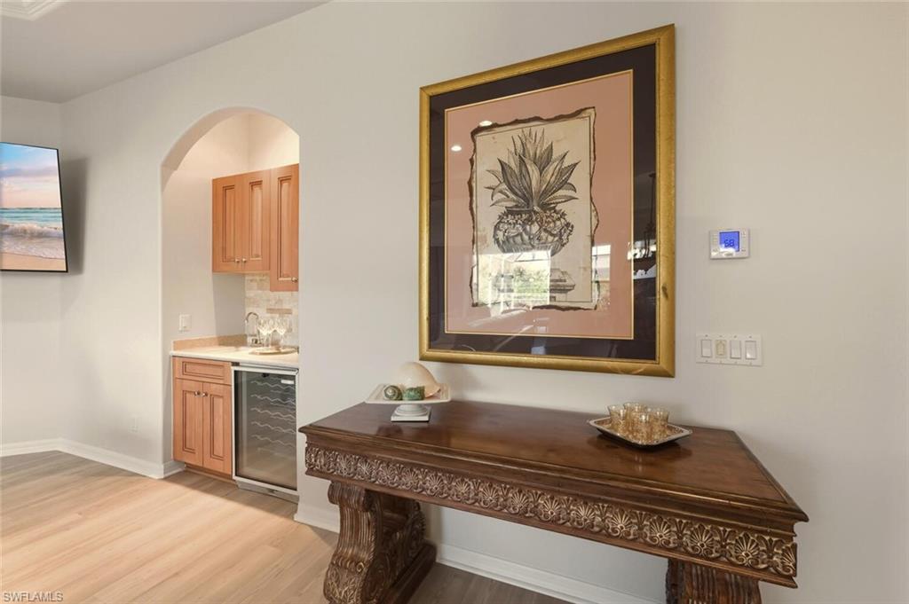 10800 Fieldfair Drive Naples, FL 34119 - Photo 30 of 47 Hall featuring wine cooler and light wood-style flooring