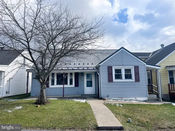 a front view of a house with yard