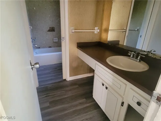 a bathroom with a sink a toilet and tub