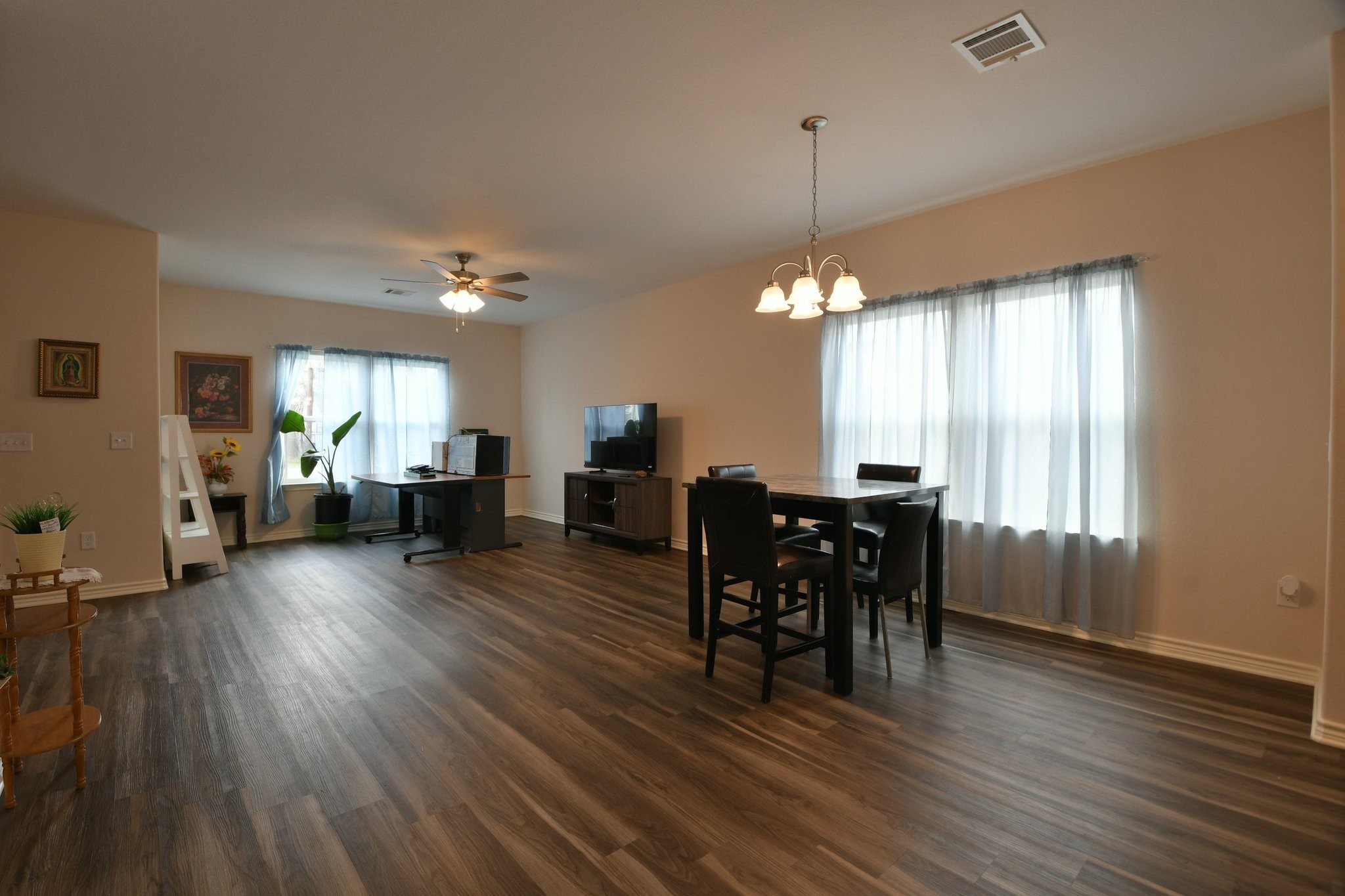 5817 Gaston Houston, TX 77016 - Photo 12 of 24 a view of a dining room with furniture window and wooden floor