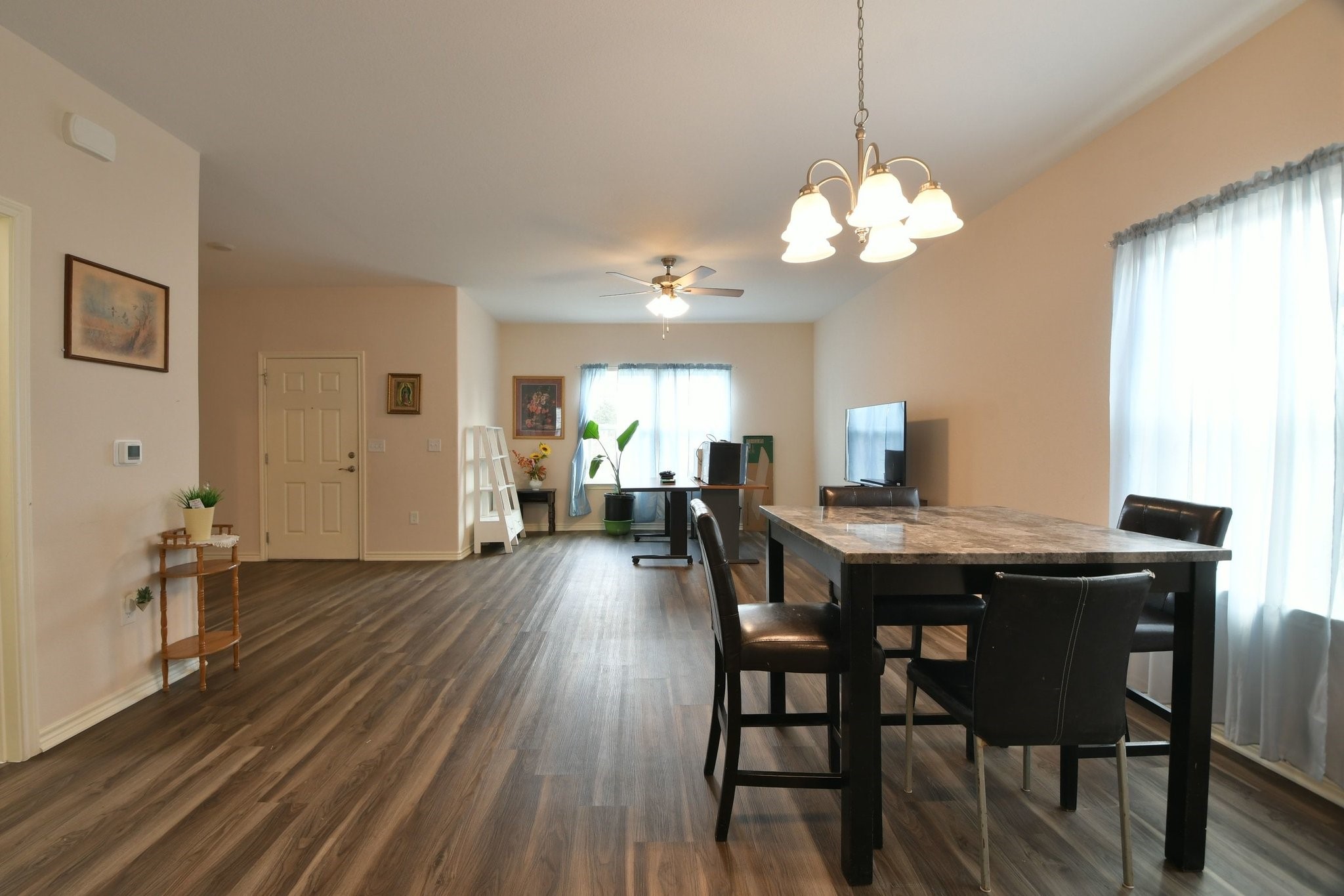 5817 Gaston Houston, TX 77016 - Photo 13 of 24 a view of a dining room with furniture window and wooden floor