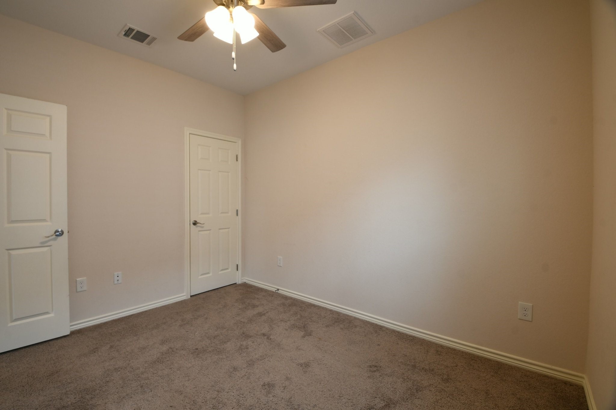 5817 Gaston Houston, TX 77016 - Photo 23 of 24 an empty room with a chandelier fan