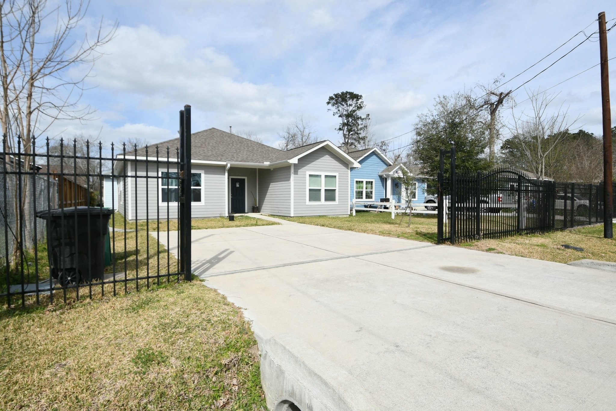 5817 Gaston Houston, TX 77016 - Photo 4 of 24 a front view of a house with a garden