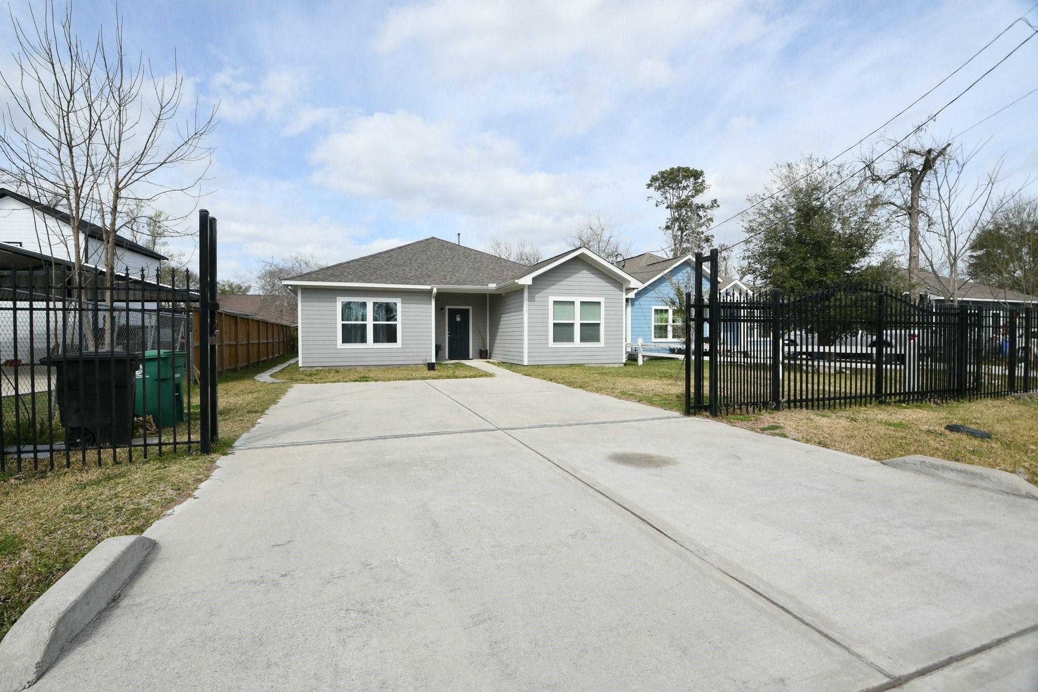 5817 Gaston Houston, TX 77016 - Photo 5 of 24 a front view of a house with a garden