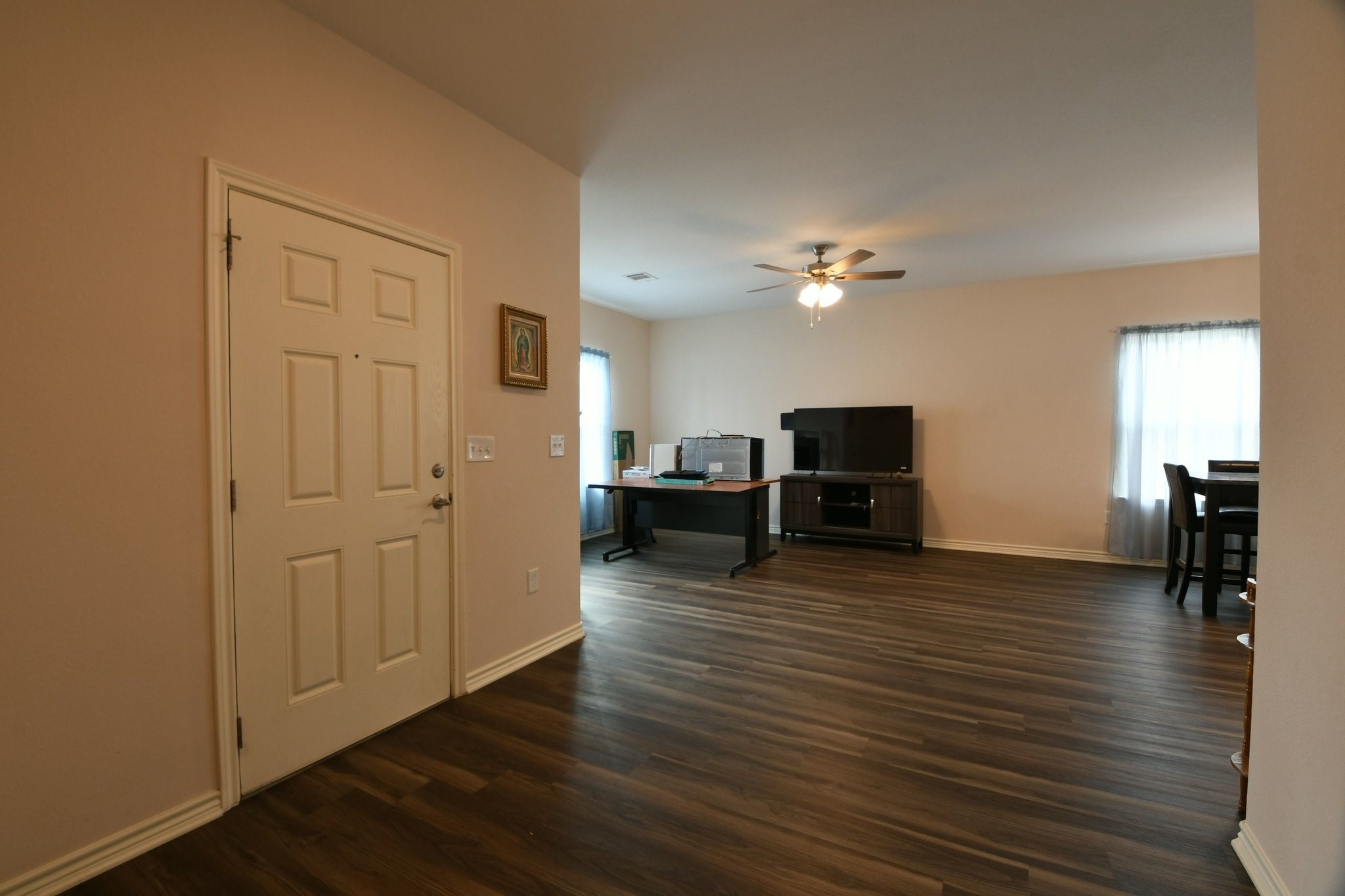 5817 Gaston Houston, TX 77016 - Photo 9 of 24 a living room with furniture and a flat screen tv