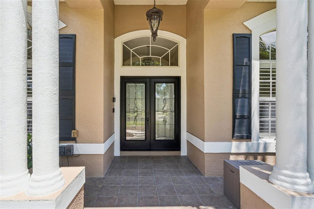 2230 Ridgewind Way Windermere, FL 34786 - Photo 4 of 38 a front view of a house with a porch