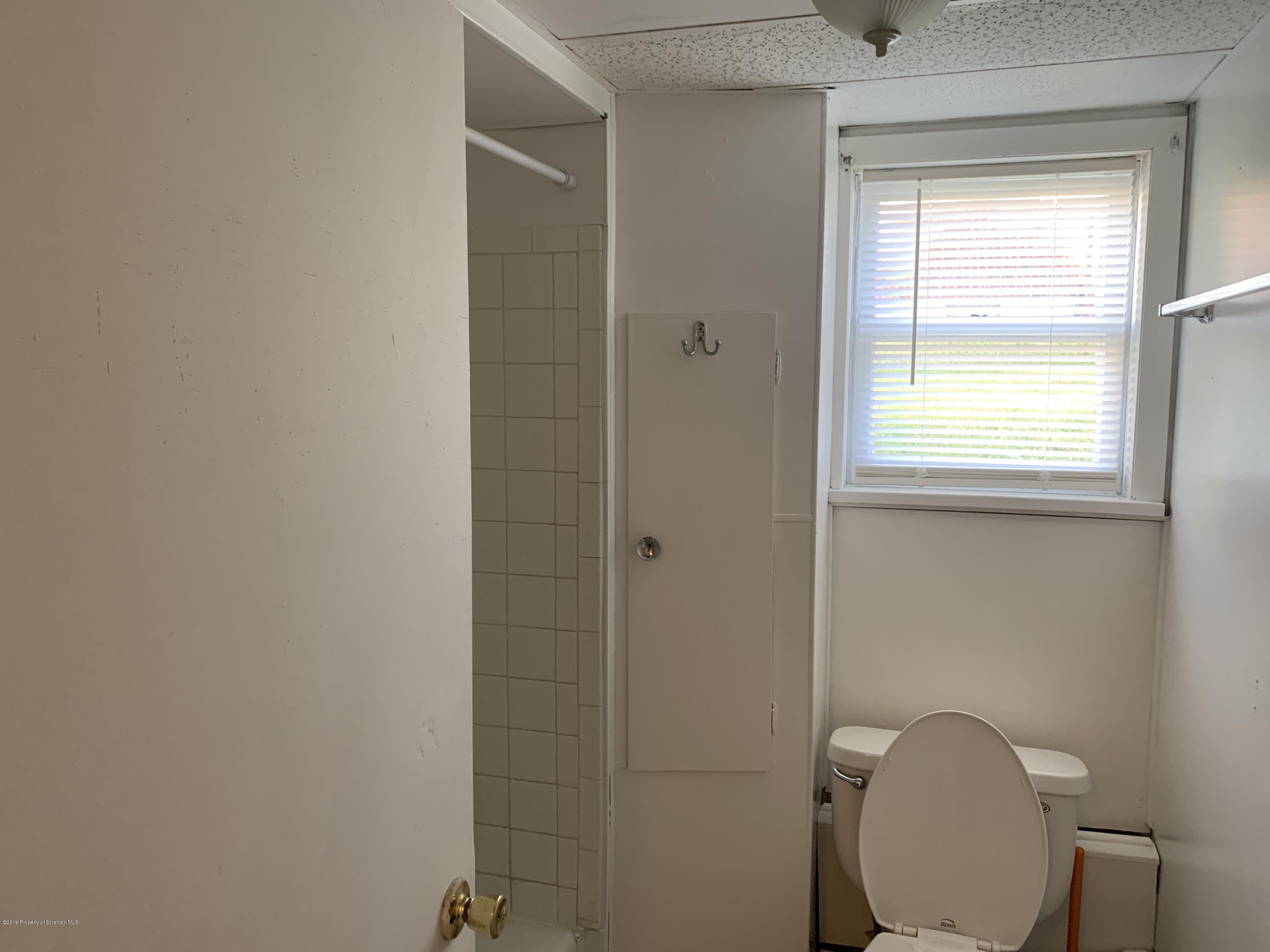 1849 Clearview Street Scranton, PA 18508 - Photo 6 of 21 a bathroom with a toilet and a mirror