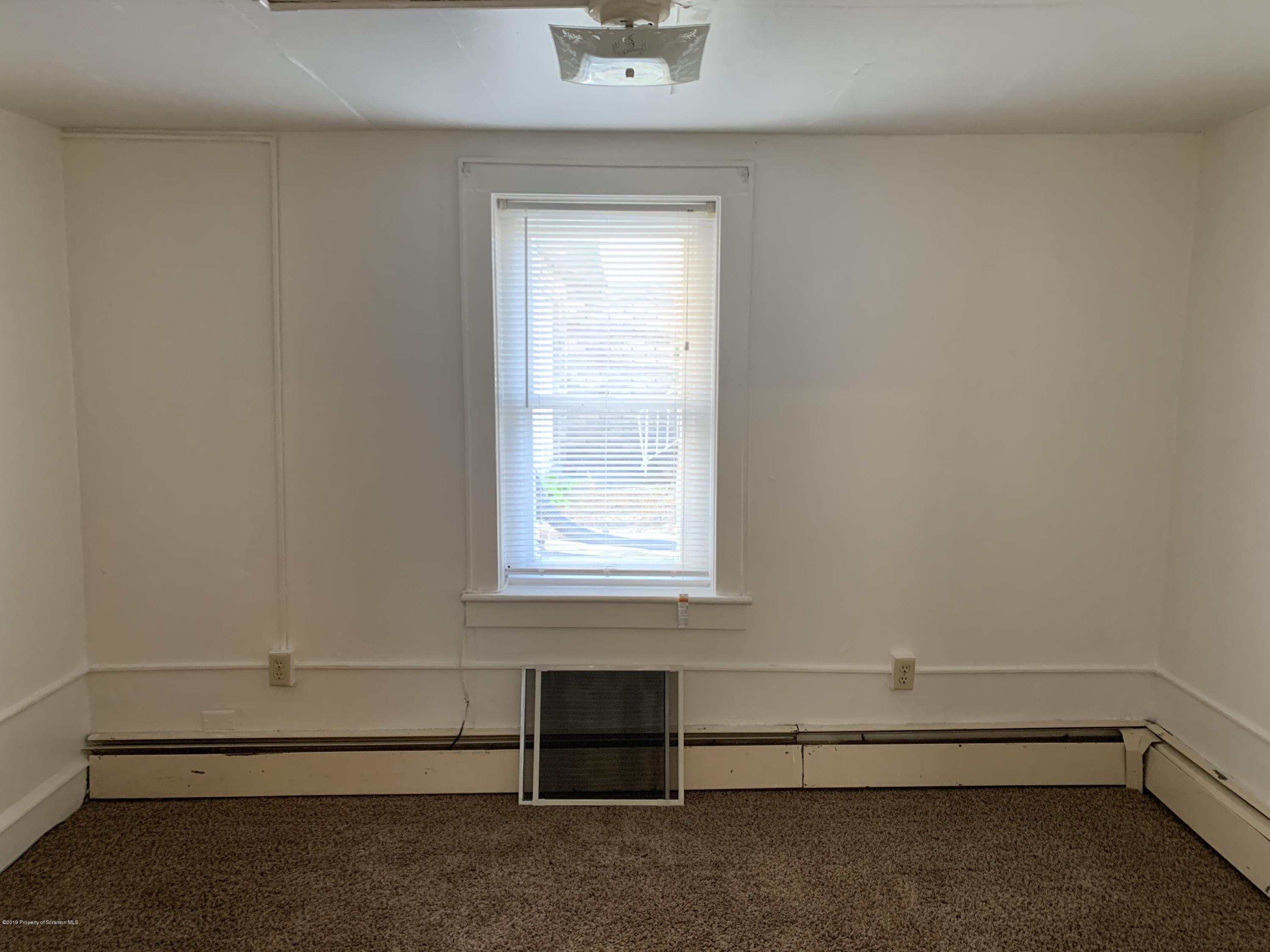 1849 Clearview Street Scranton, PA 18508 - Photo 7 of 21 a room with a window and ceiling fan