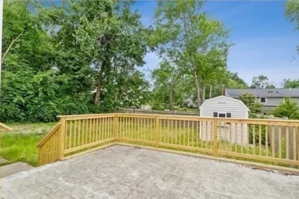 a view of a deck with a fence