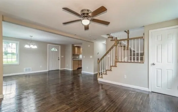 a view of an entryway with wooden floor