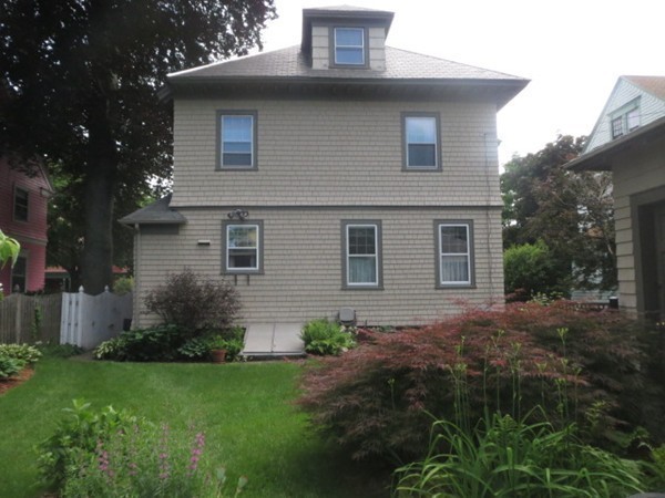 54 Garfield Street Springfield, MA 01108 - Photo 28 of 30 a backyard of a house with lots of green space