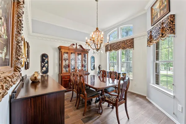 a view of a dining room with furniture window and outside view