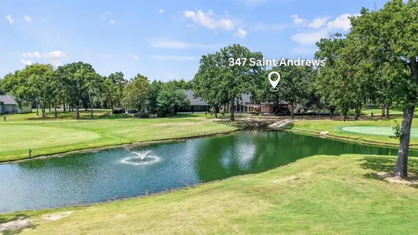 a view of a lake with a big yard