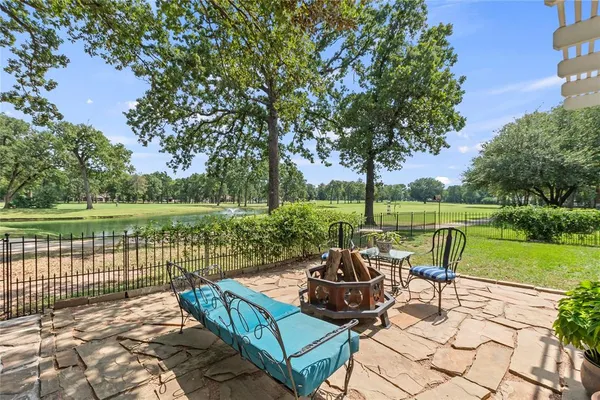 a view of a chair and table on the patio