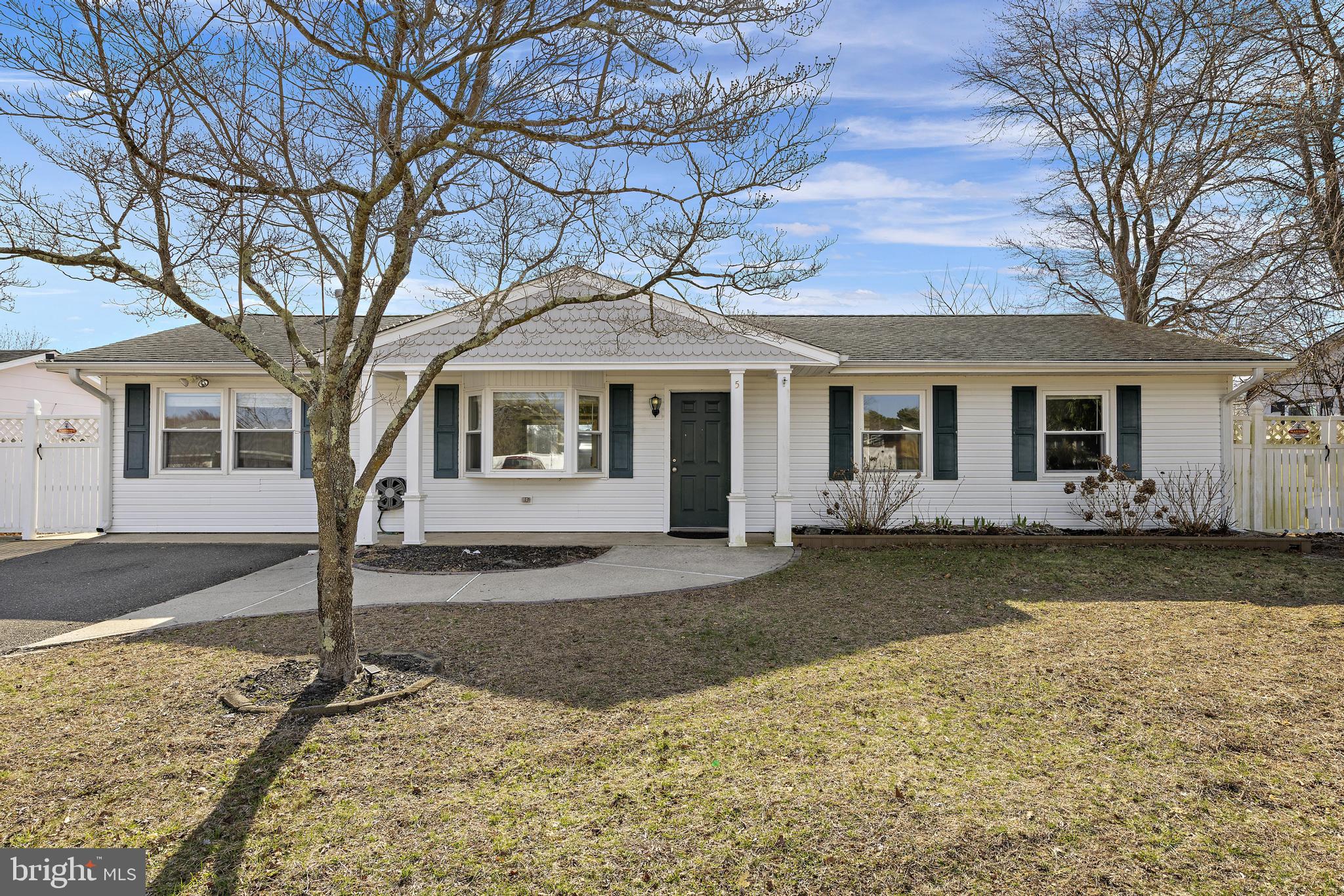 5 Fresno Street Barnegat, NJ 08005 - Photo 1 of 43 a front view of a house with garden