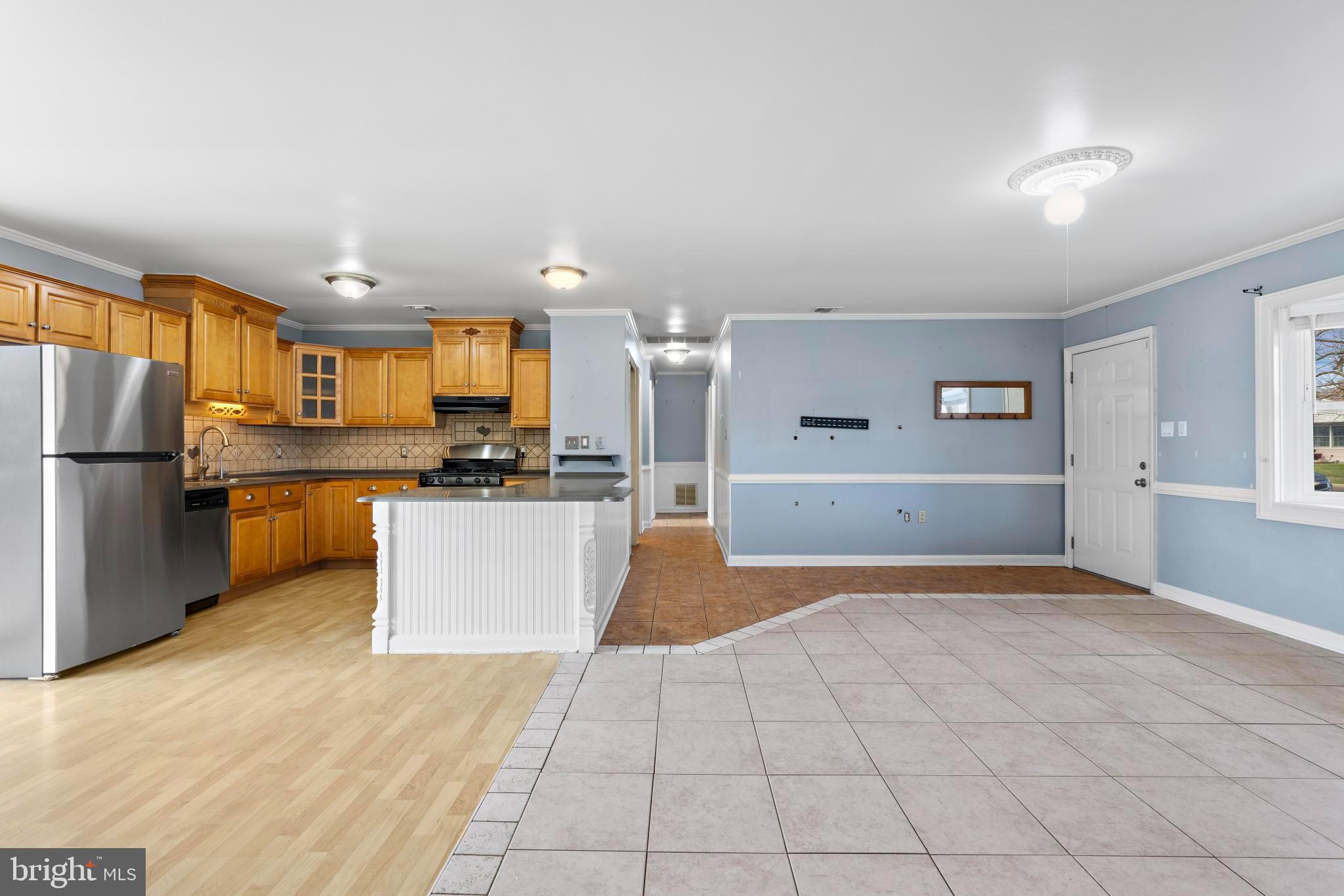 5 Fresno Street Barnegat, NJ 08005 - Photo 12 of 43 a view of a kitchen with kitchen island white cabinets and stainless steel appliances