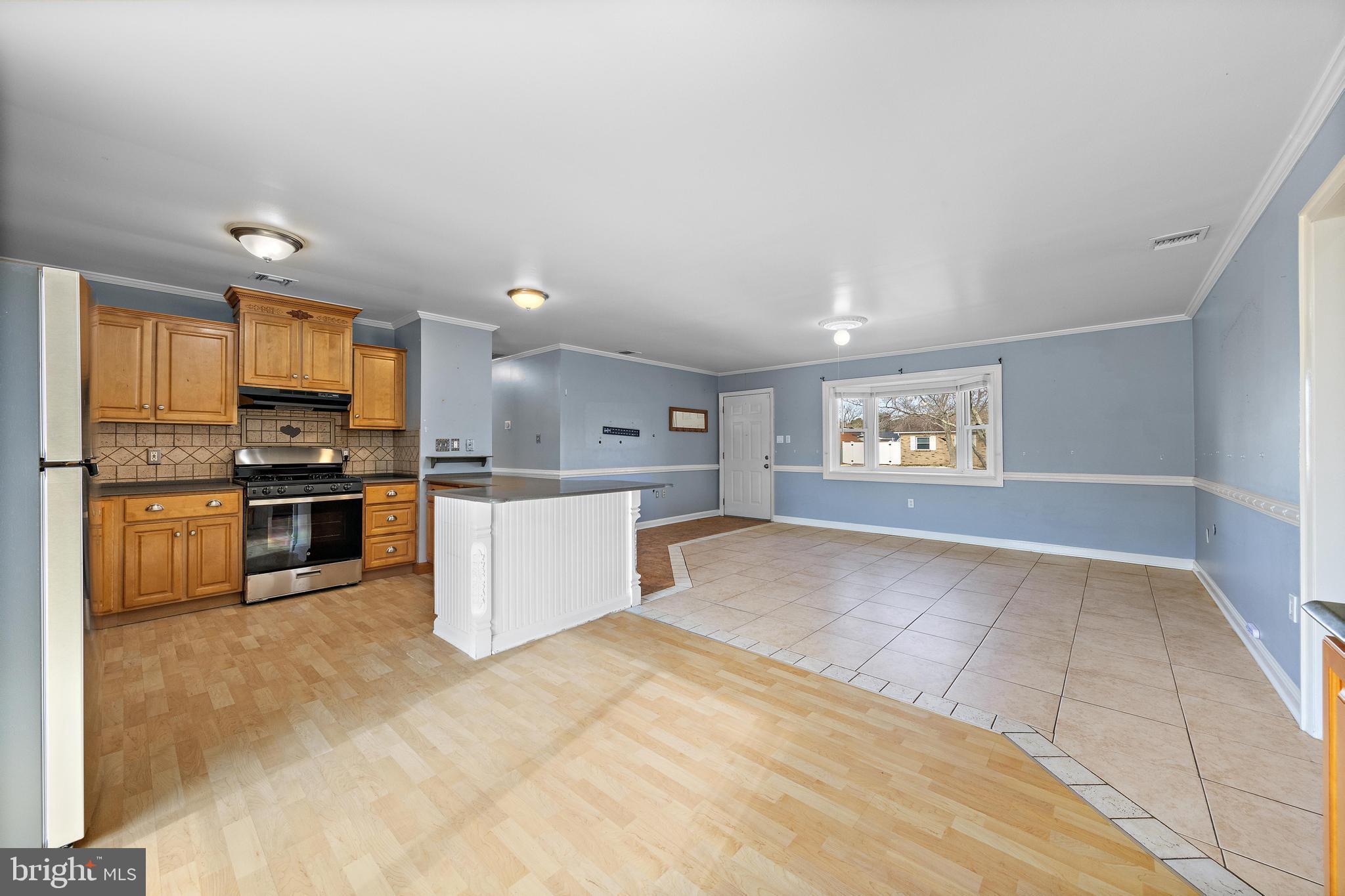 5 Fresno Street Barnegat, NJ 08005 - Photo 13 of 43 a kitchen with stainless steel appliances a refrigerator and a stove top oven