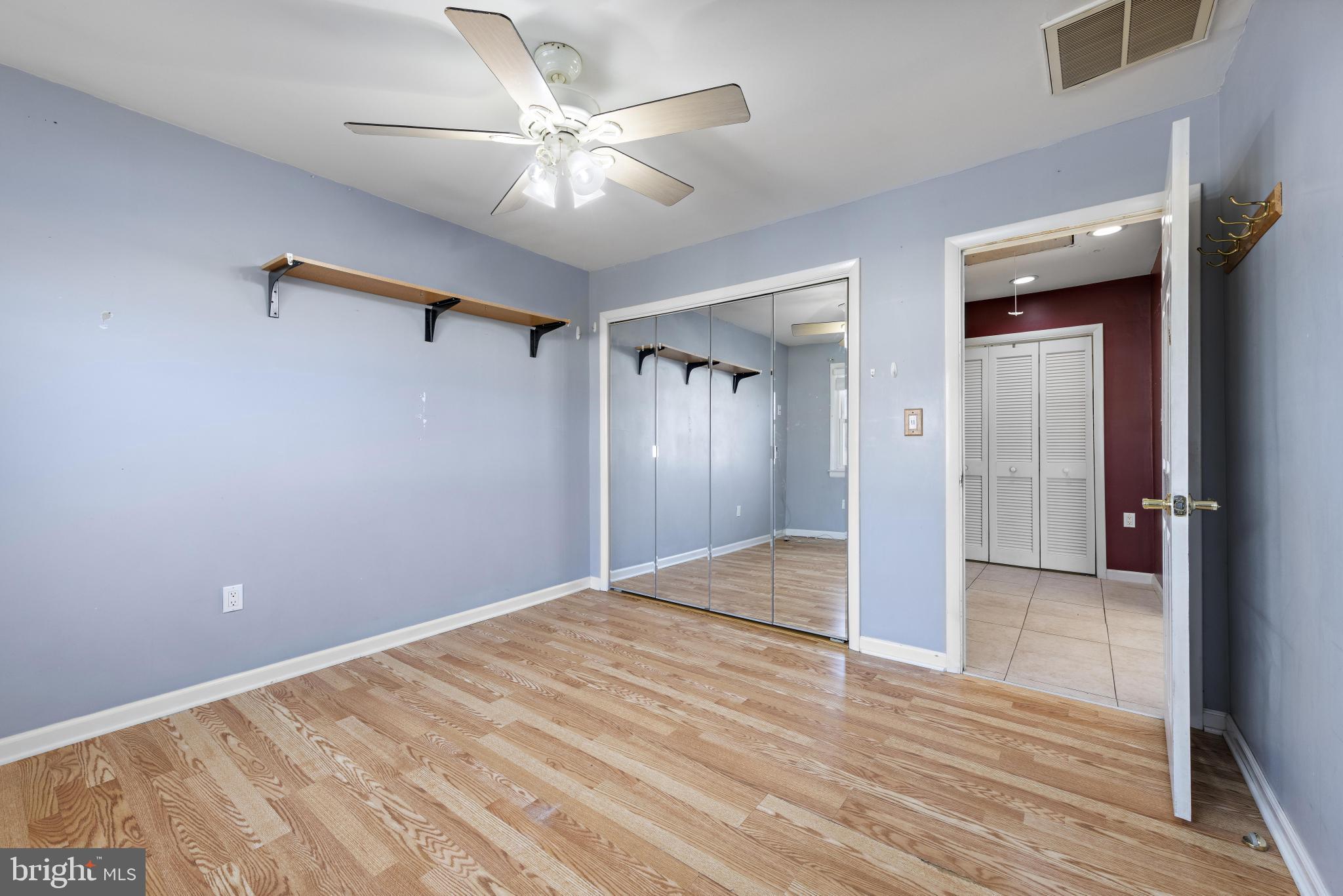 5 Fresno Street Barnegat, NJ 08005 - Photo 28 of 43 a view of a livingroom with a ceiling fan and wooden floor