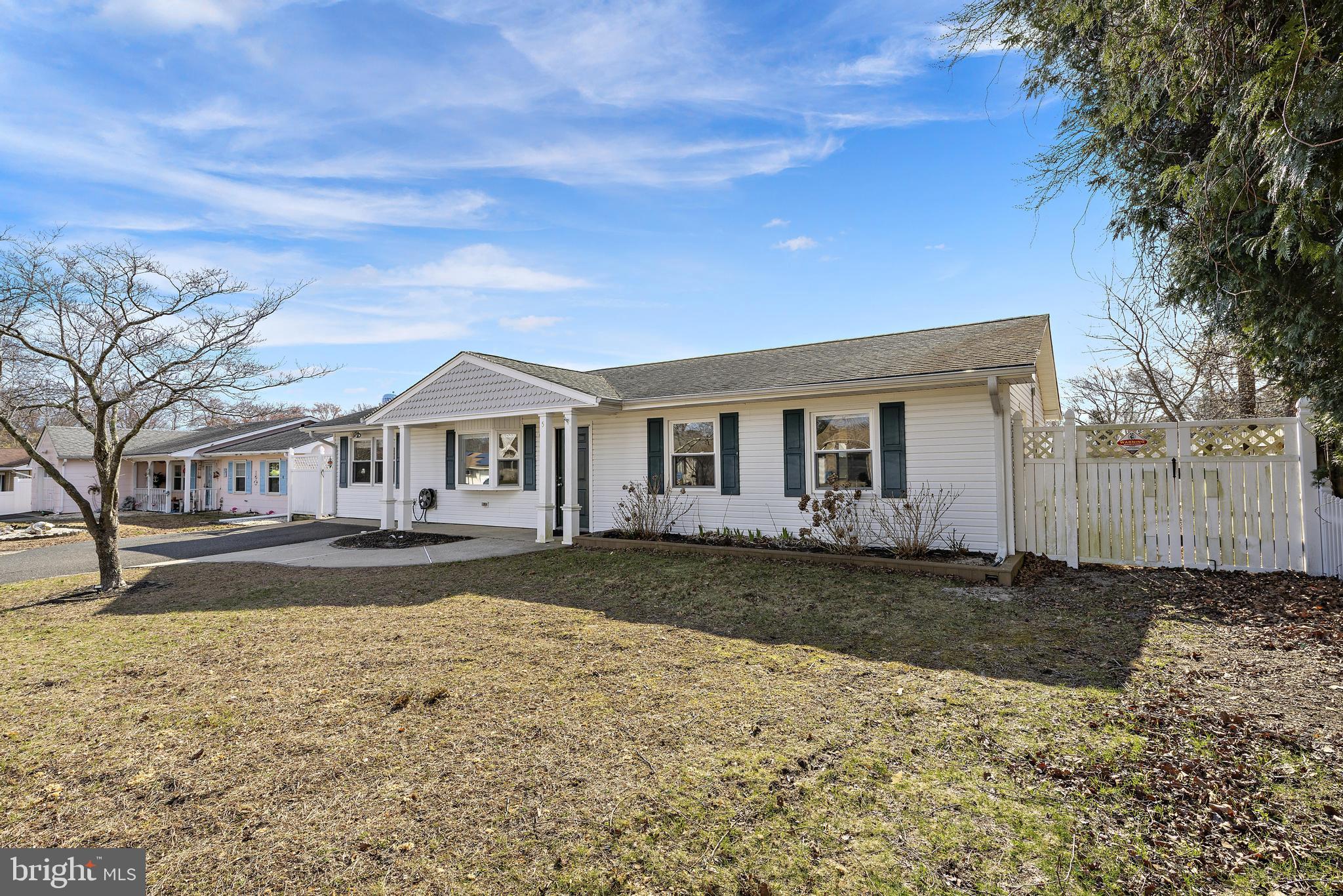 5 Fresno Street Barnegat, NJ 08005 - Photo 3 of 43 a front view of a house with a yard