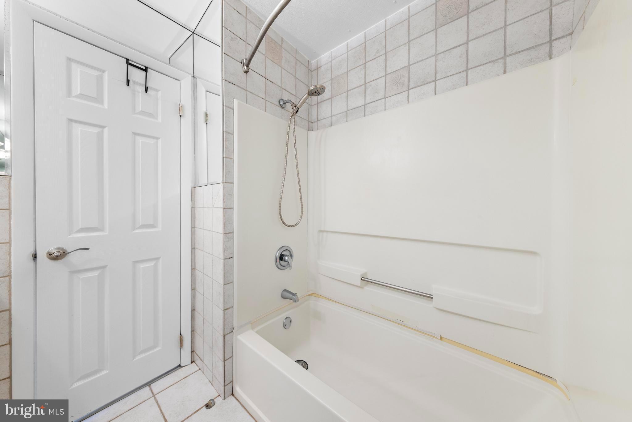 5 Fresno Street Barnegat, NJ 08005 - Photo 33 of 43 a bathroom with a bathtub and a shower