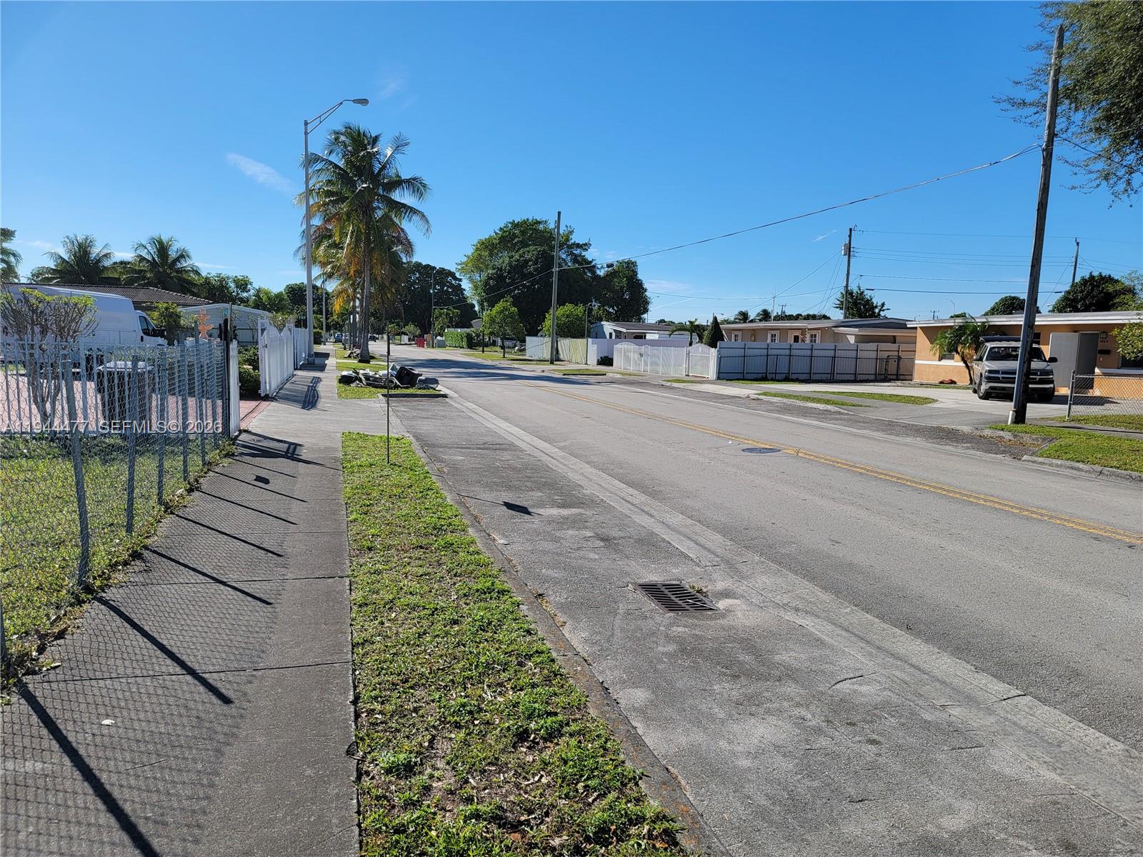 3895 West 2nd Avenue Hialeah, FL 33012 - Photo 4 of 10 a view of a yard and car parked
