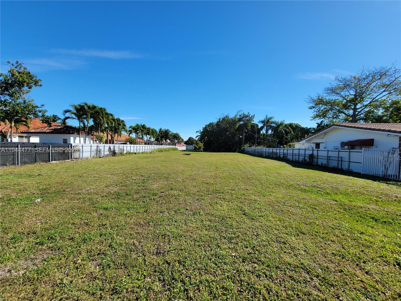 3895 West 2nd Avenue Hialeah, FL 33012 - Photo 10 of 10 a view of a pool with an outdoor space and seating area