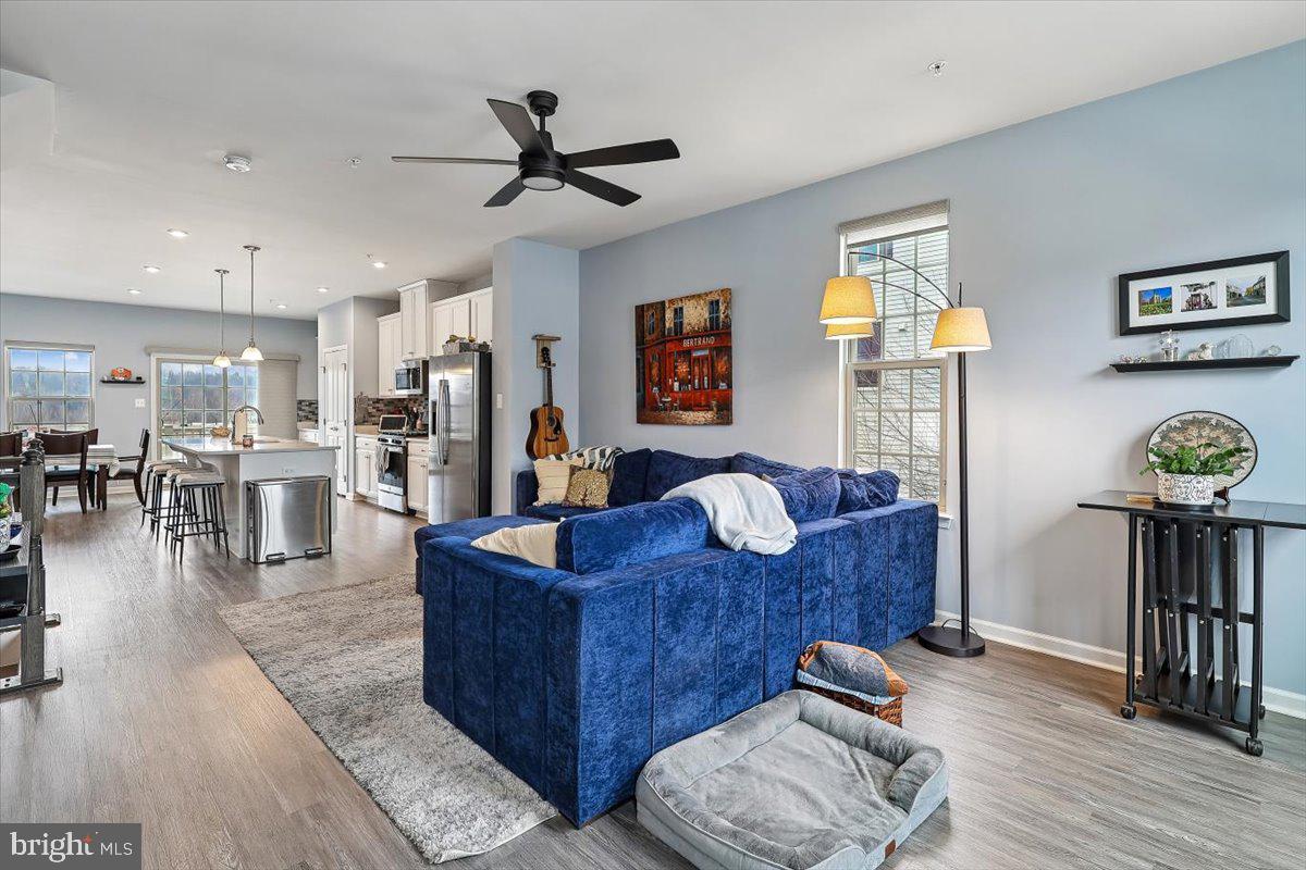 7838 Mine Run Road Hanover, MD 21076 - Photo 12 of 30 a living room with furniture and a view of kitchen