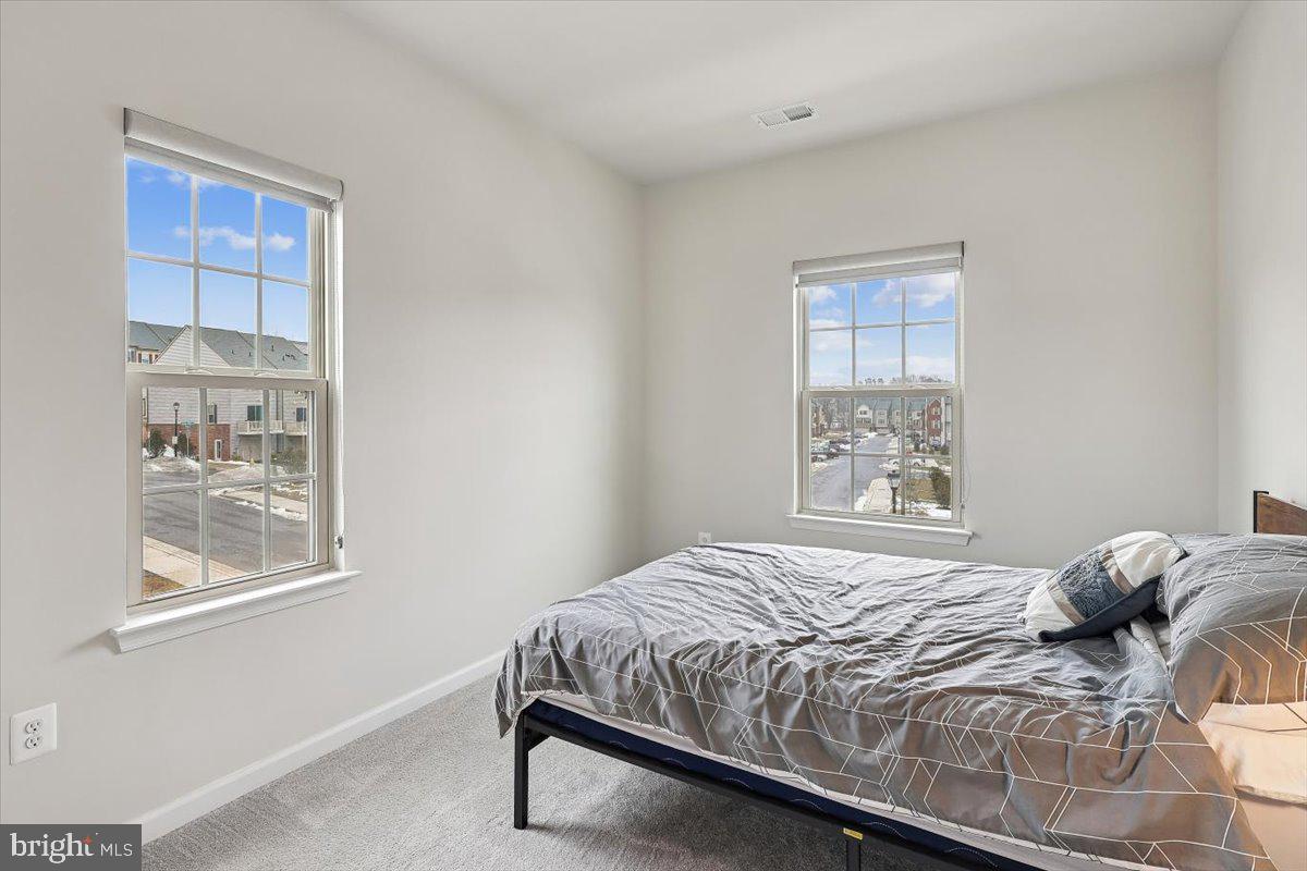 7838 Mine Run Road Hanover, MD 21076 - Photo 20 of 30 a bedroom with a bed and a window