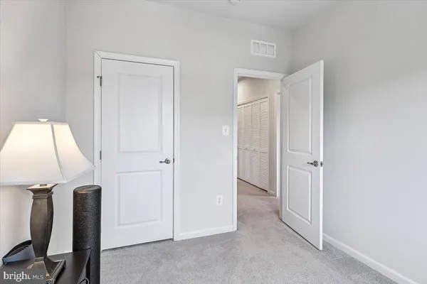 a view of a room with a wardrobe space