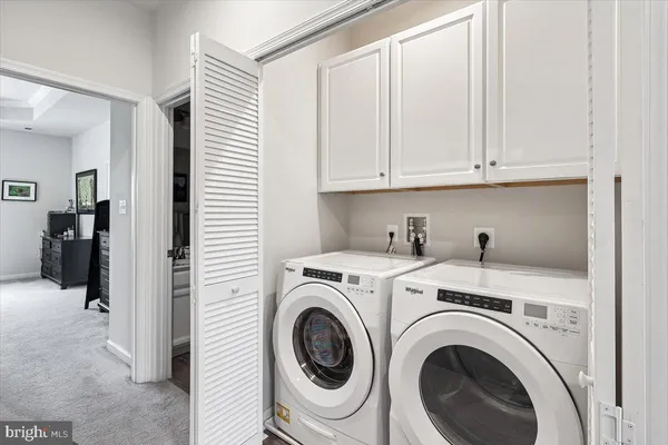 a view of hallway with washer and dryer