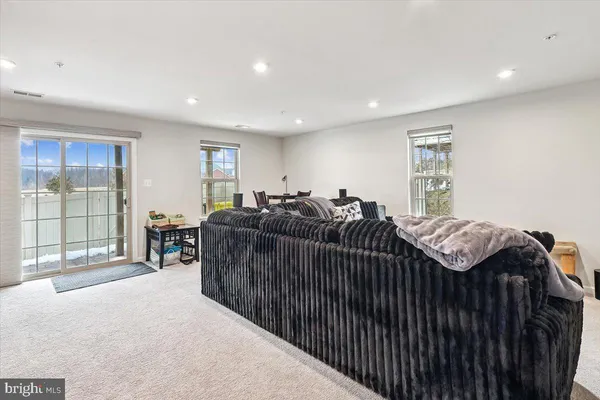 a bed room with a bed and a large window