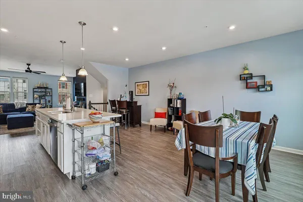 a view of a dining area with furniture and wooden floor