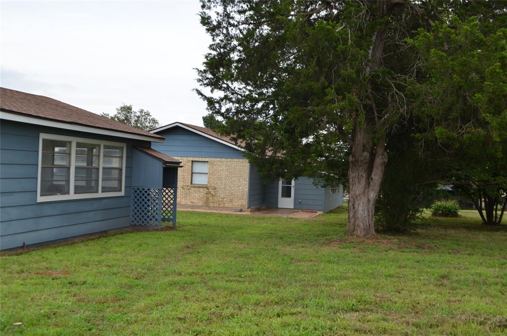 2020 Gage Road Cleburne, TX 76031 - Photo 8 of 12 Expansive grassy yard area featuring mature trees
