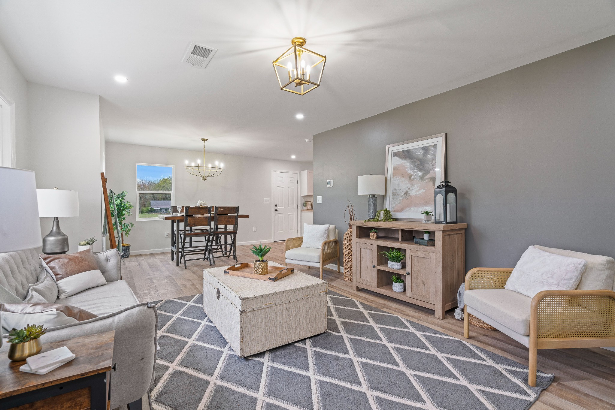 5284 Flewellyn Road Springfield, TN 37172 - Photo 8 of 57 a living room with furniture a rug kitchen view and a chandelier