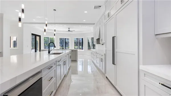 a view of a kitchen and an entryway