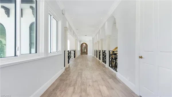 a kitchen with stainless steel appliances wooden cabinets a stove top oven a sink with wooden floor and cabinets