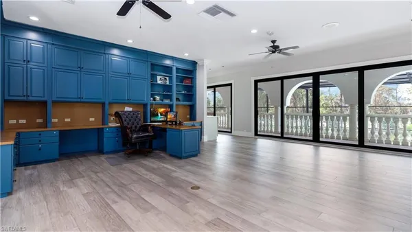 a white bath tub sitting next to a bathroom sink
