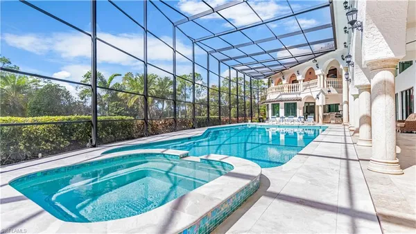 a swimming pool with large trees and outdoor space