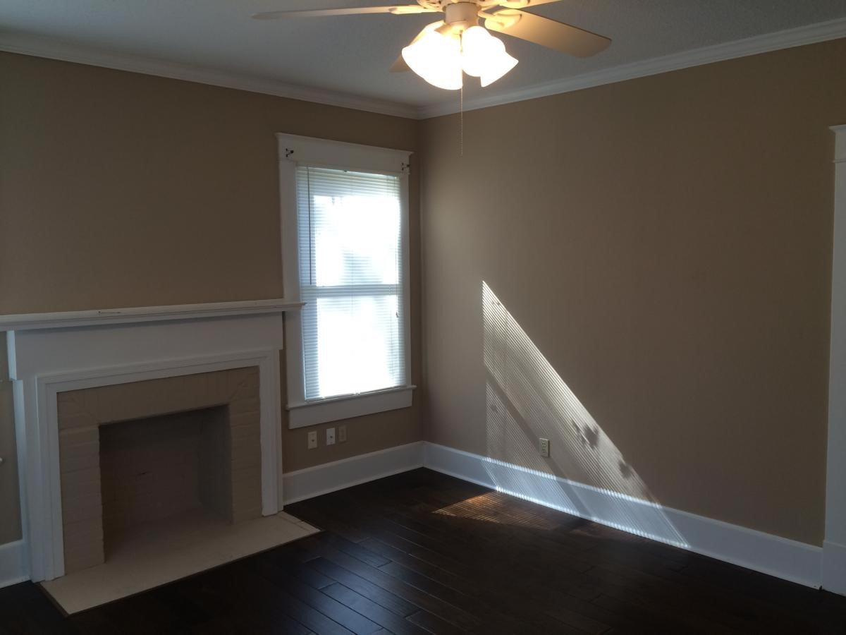 403 South 7th Street, Unit 1 Crockett, TX 75835 - Photo 8 of 8 a view of an empty room with wooden floor and a window