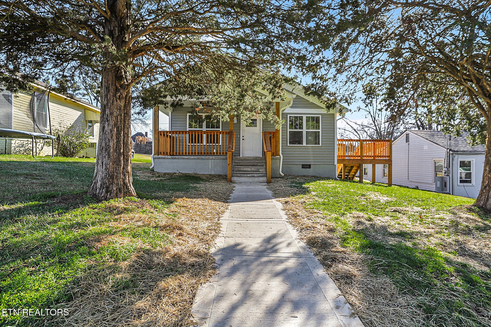 1134 Rider Avenue Knoxville, TN 37917 - Photo 2 of 44 a front view of a house with a yard and garage