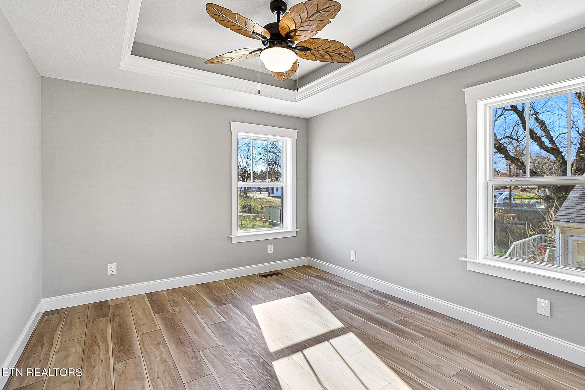 1134 Rider Avenue Knoxville, TN 37917 - Photo 24 of 44 a view of an empty room with a window and wooden floor