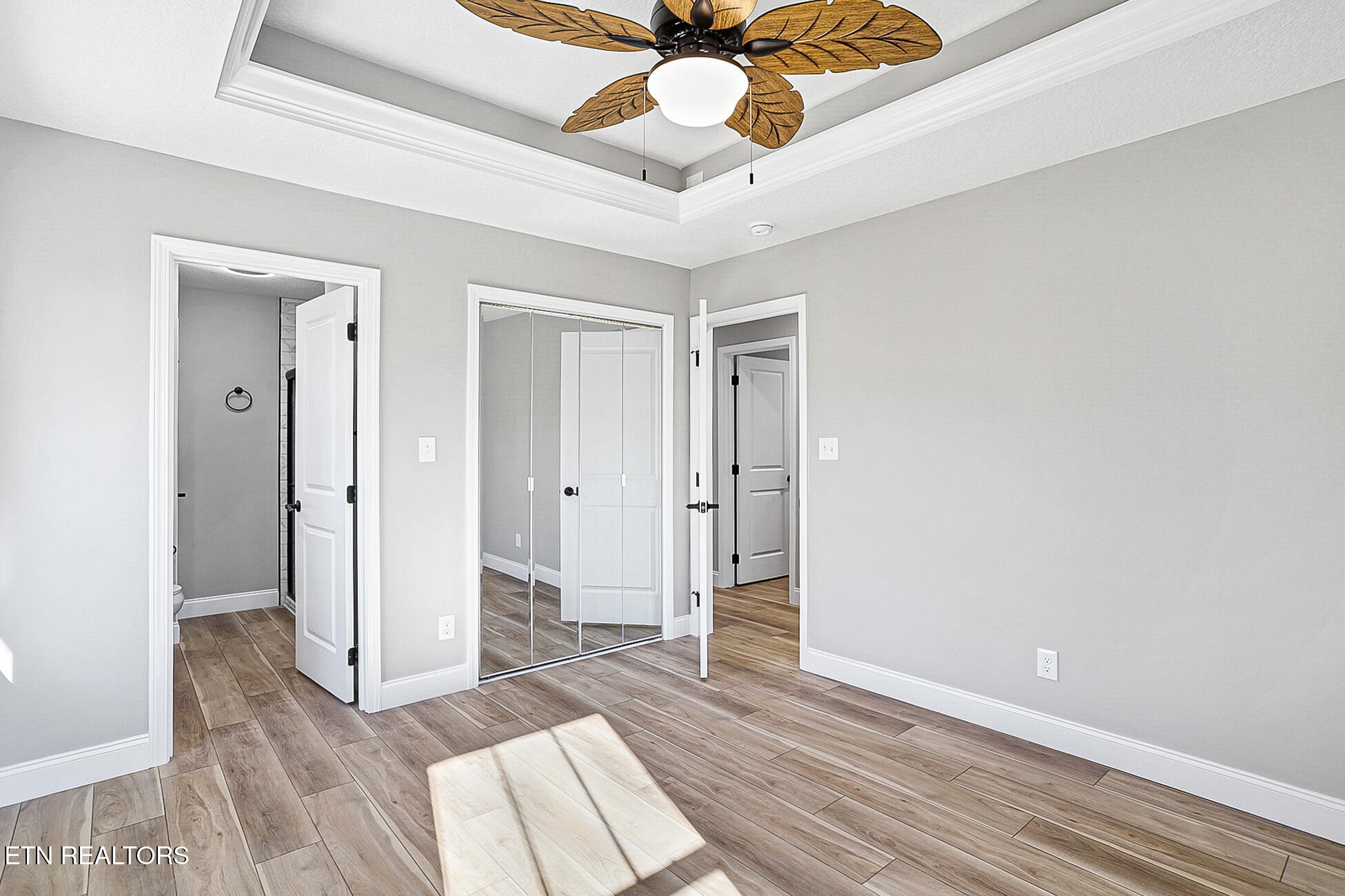 1134 Rider Avenue Knoxville, TN 37917 - Photo 26 of 44 a view of a room with wooden floor and ceiling fan