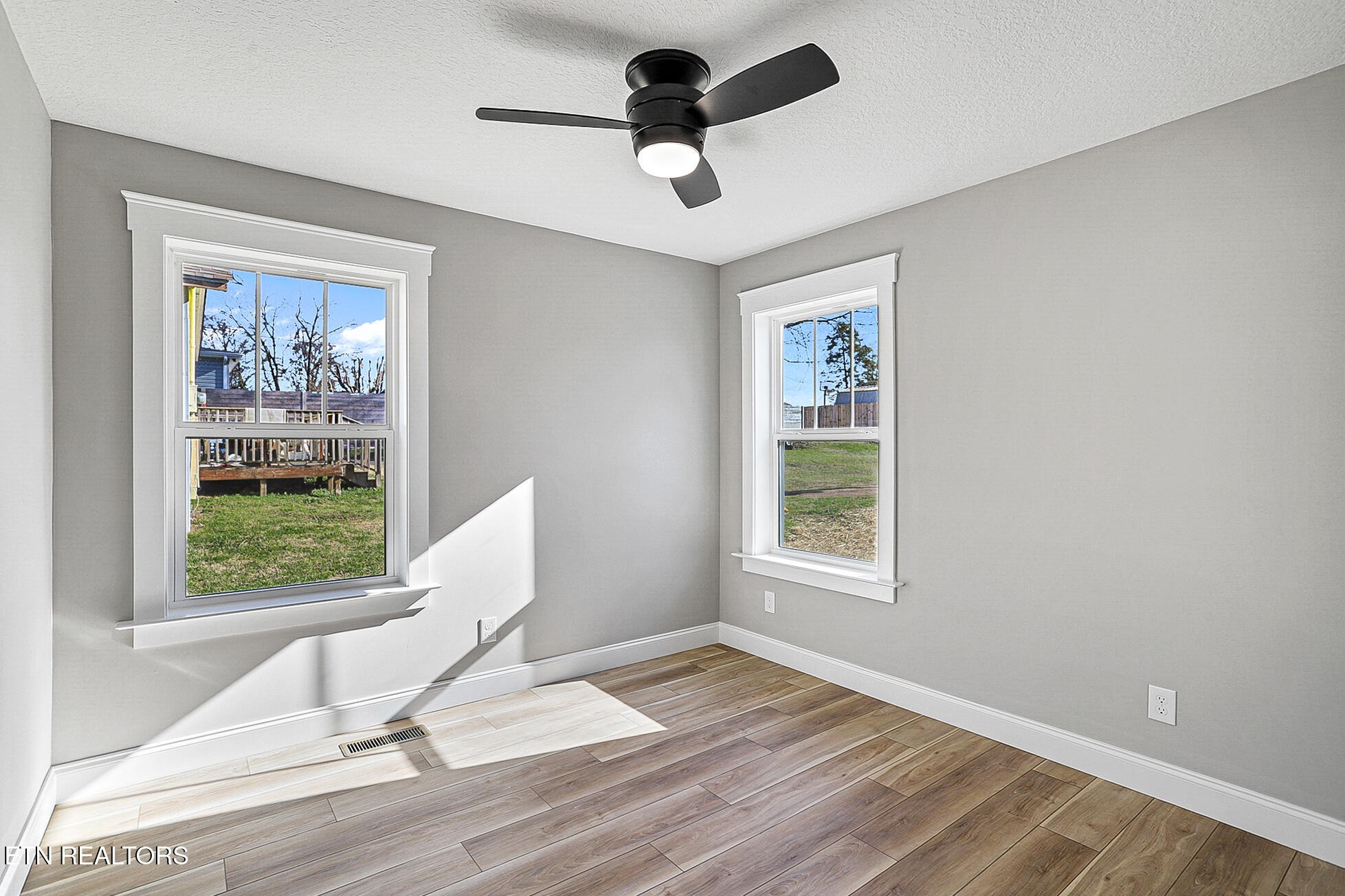 1134 Rider Avenue Knoxville, TN 37917 - Photo 31 of 44 a view of a room with a window and wooden floor