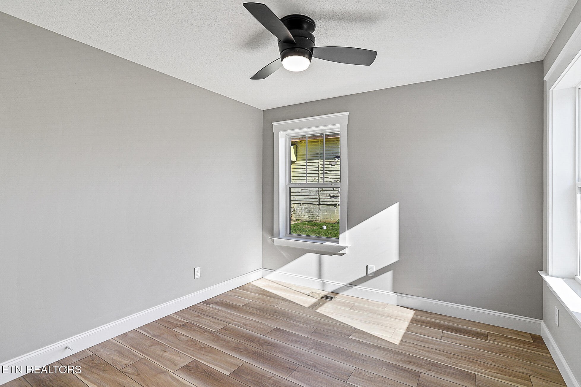 1134 Rider Avenue Knoxville, TN 37917 - Photo 33 of 44 a workspace with wooden floor and white walls